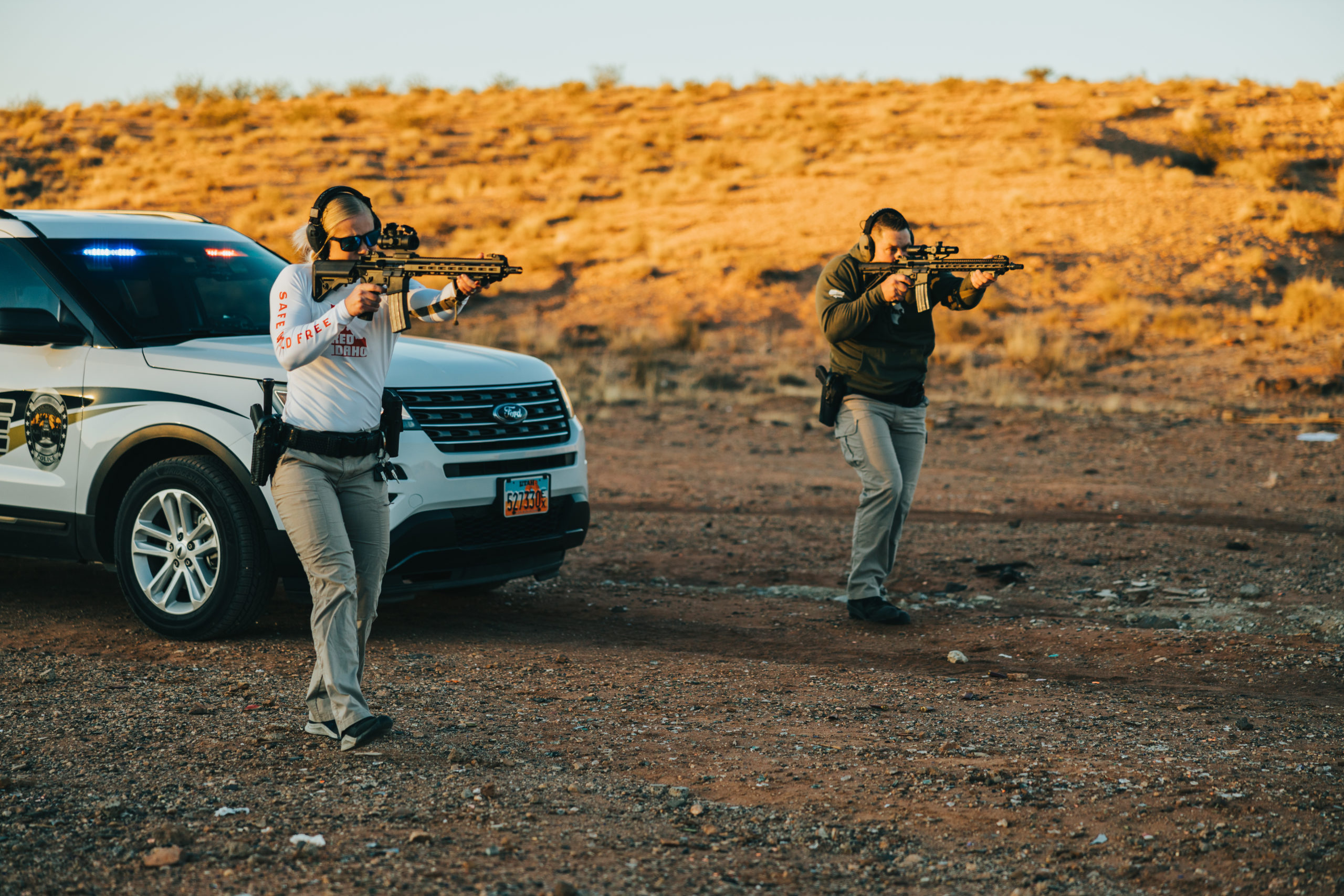 Desert Officers Holding Guns